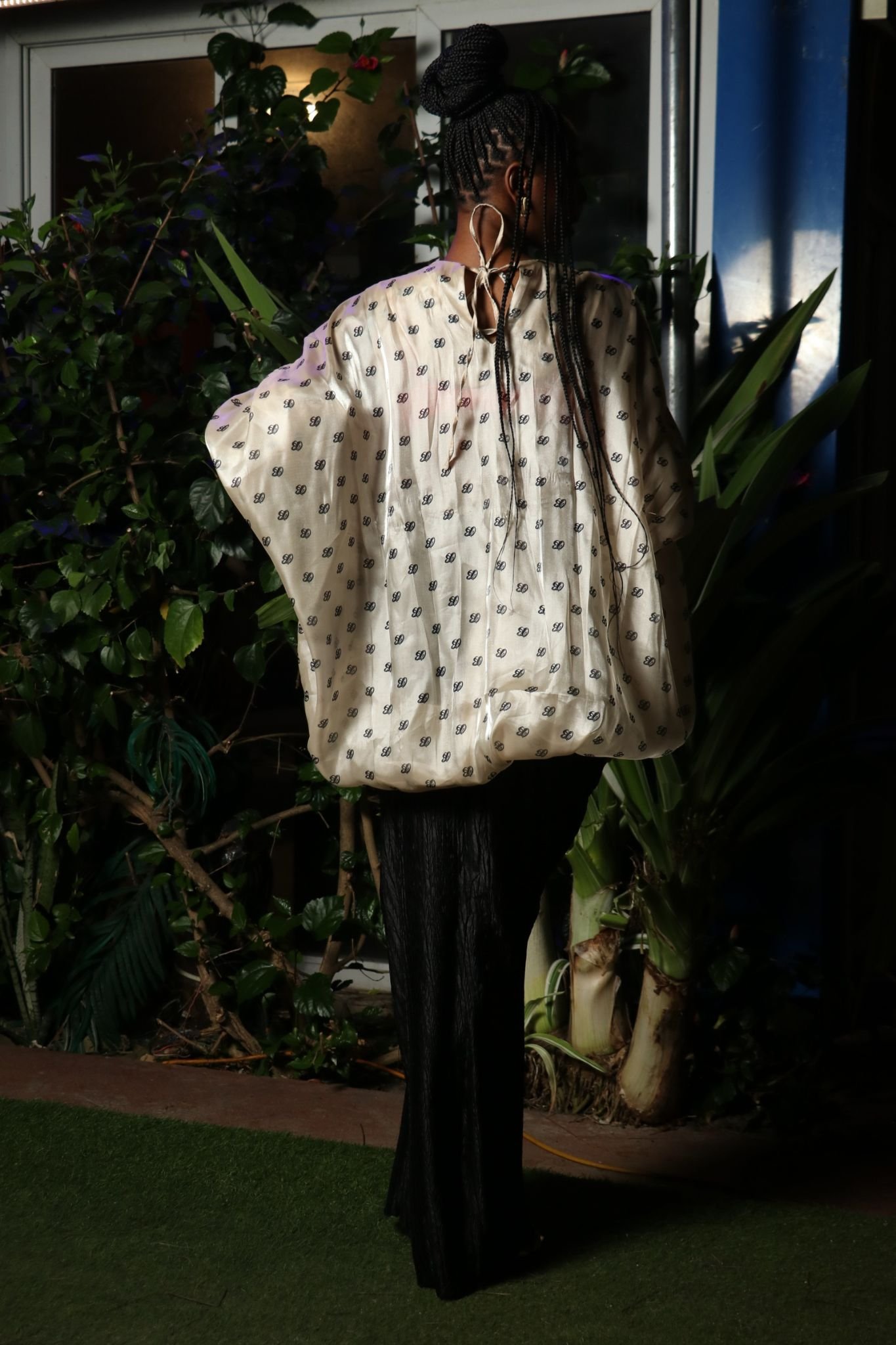 Off-White Patterned Top and Black Skirt Ensemble